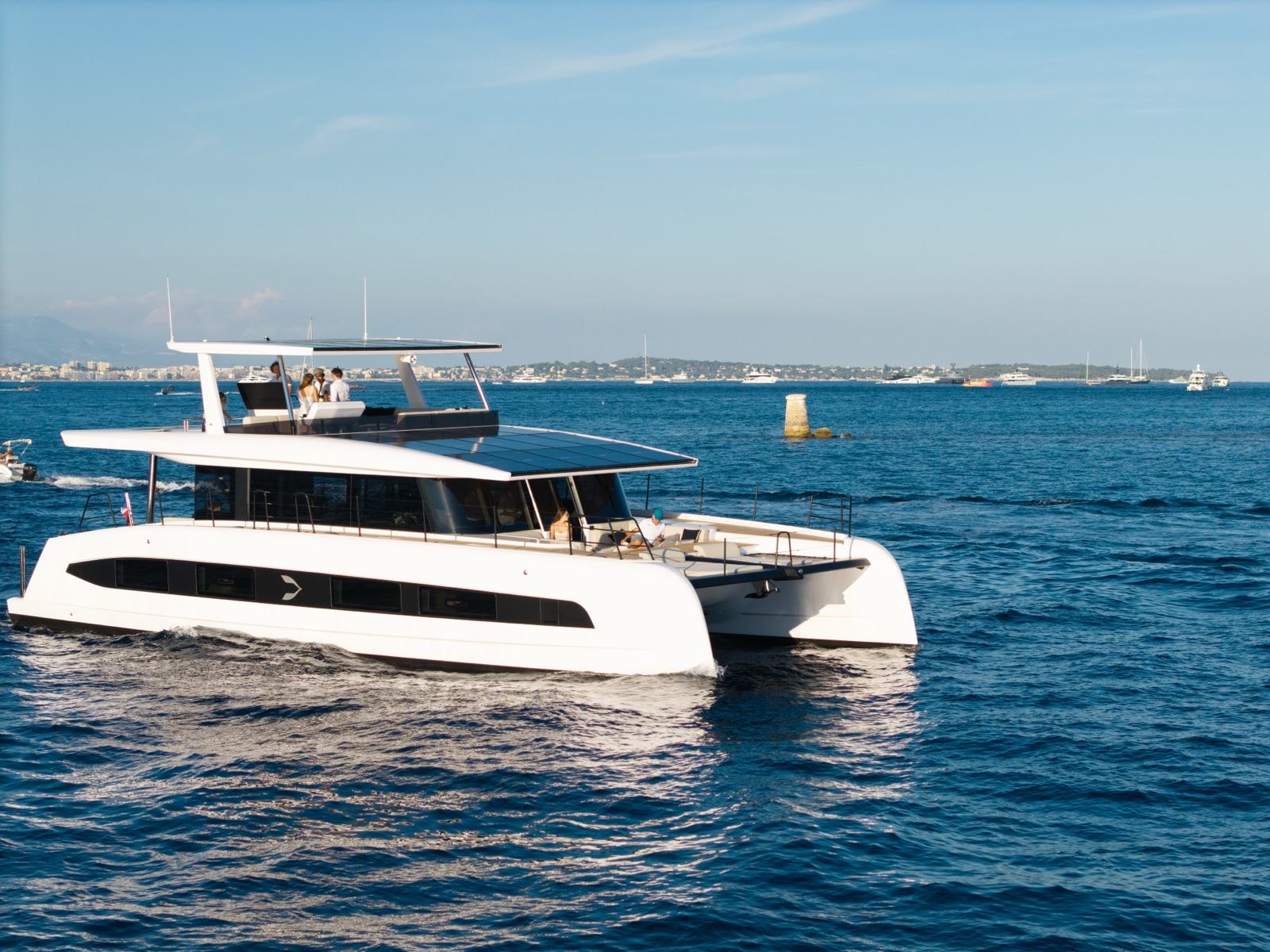 Catamaran from the side, under way